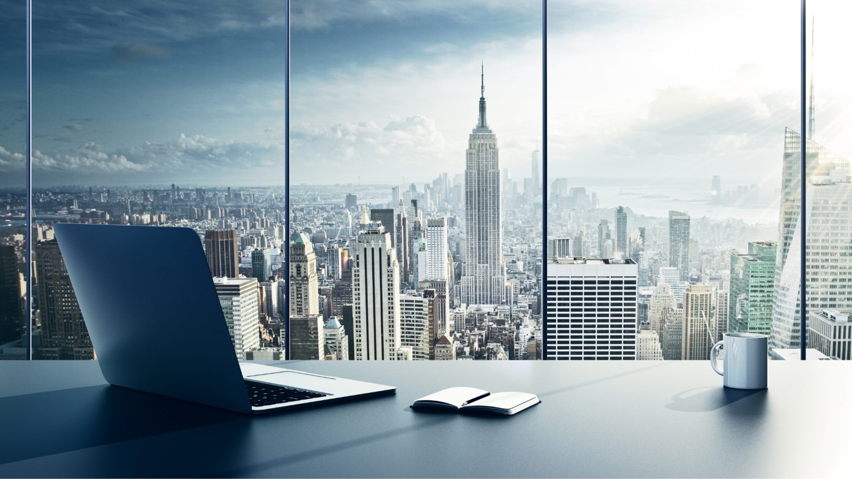 Office desk overlooking a city skyline